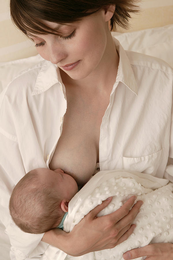 Mother nursing baby Photograph by Comstock Images