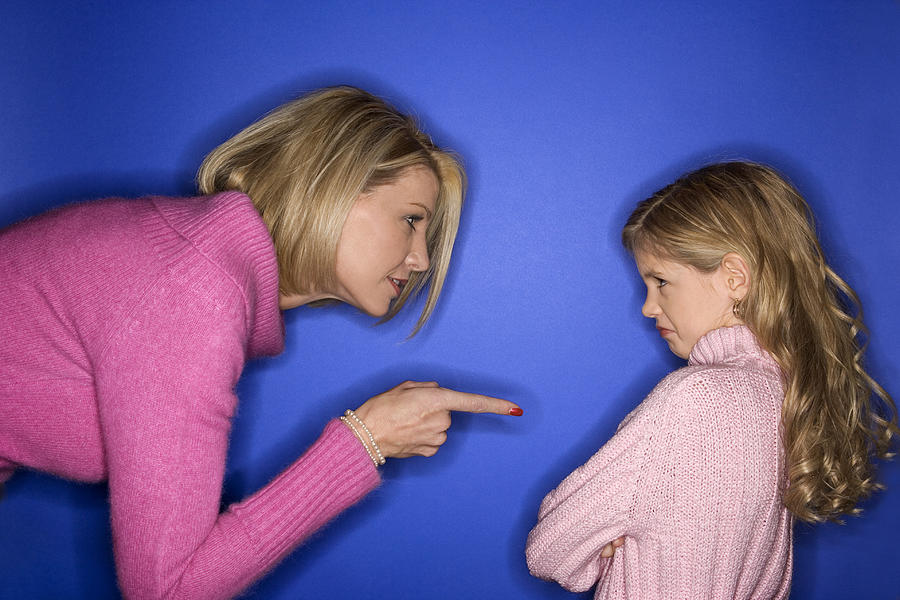 Mother scolding daughter Photograph by Thinkstock