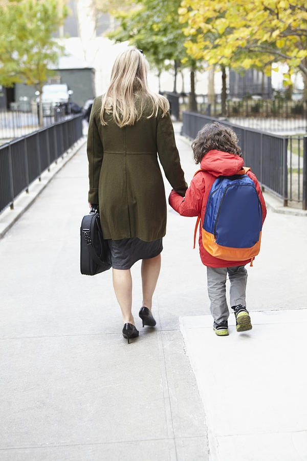 Mother taking son to school Photograph by Camille Tokerud