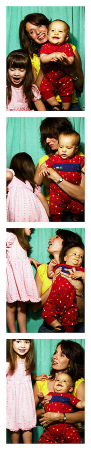 Mother with children (1-3) in photo booth Photograph by Siri Stafford
