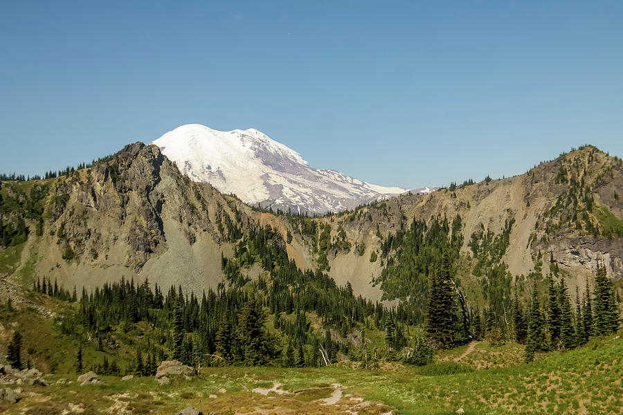 Mount Rainer Looming Over A Distant Ridgeline Photograph