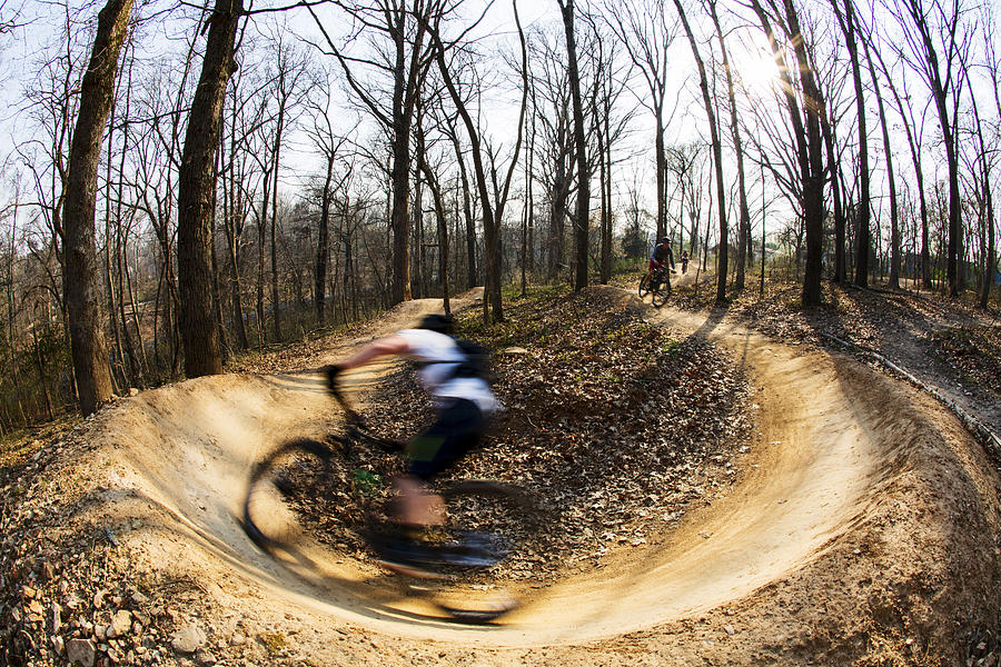 Mountain Biker Making A Turn In The Dirt Photograph by Wesley Hitt