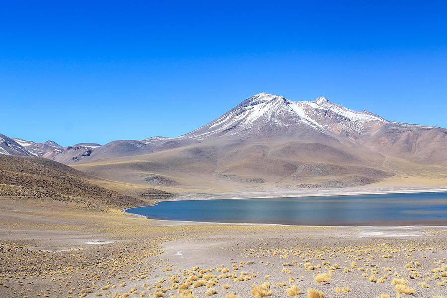 Mountain covered with snow and lake in the Atacama Desert, Chile. Photograph by Brunomsbarreto