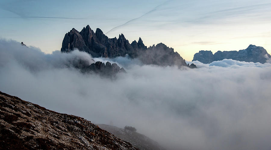 Mountain landscape with mist, at sunset Dolomites at Tre Cime Italy. Photograph by Michalakis Ppalis