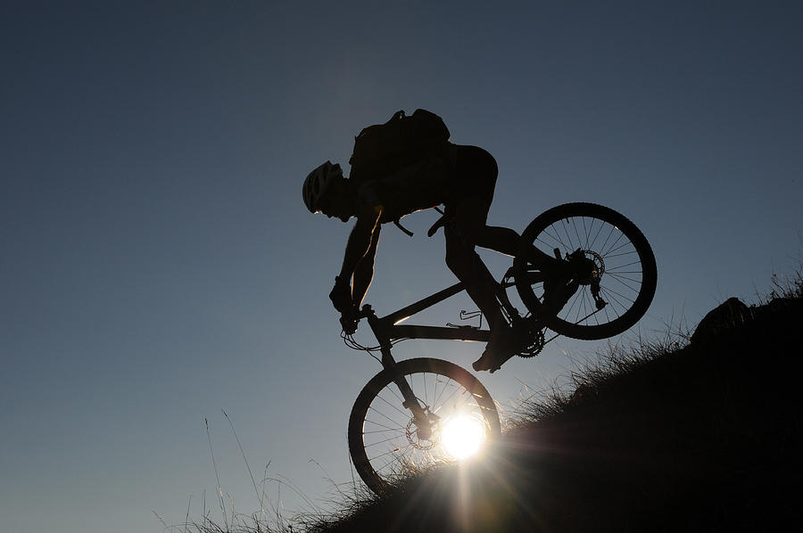 Mountainbiker in the evening Photograph by Gorfer