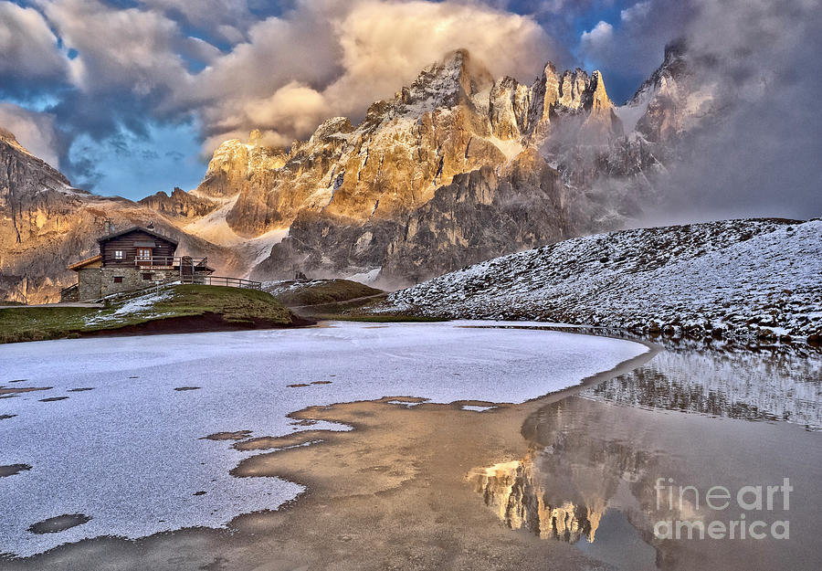 magnificent mountainous panorama at frozen lake at dawn PASSO ROLLE  May Dolomites Nothen Italy Photograph by Tatiana Bogracheva