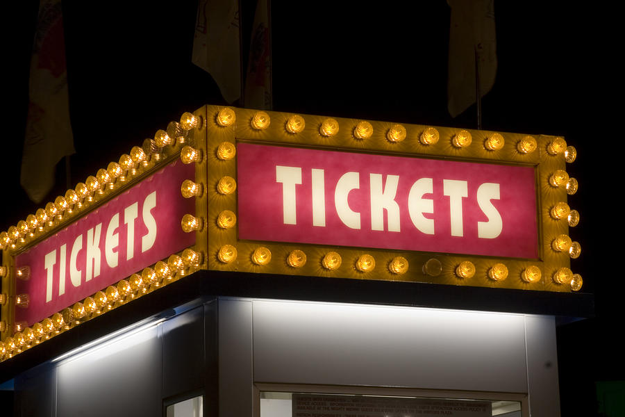 Movie Theater and Carnival Ticket Sign Lit up with Light Photograph by YinYang