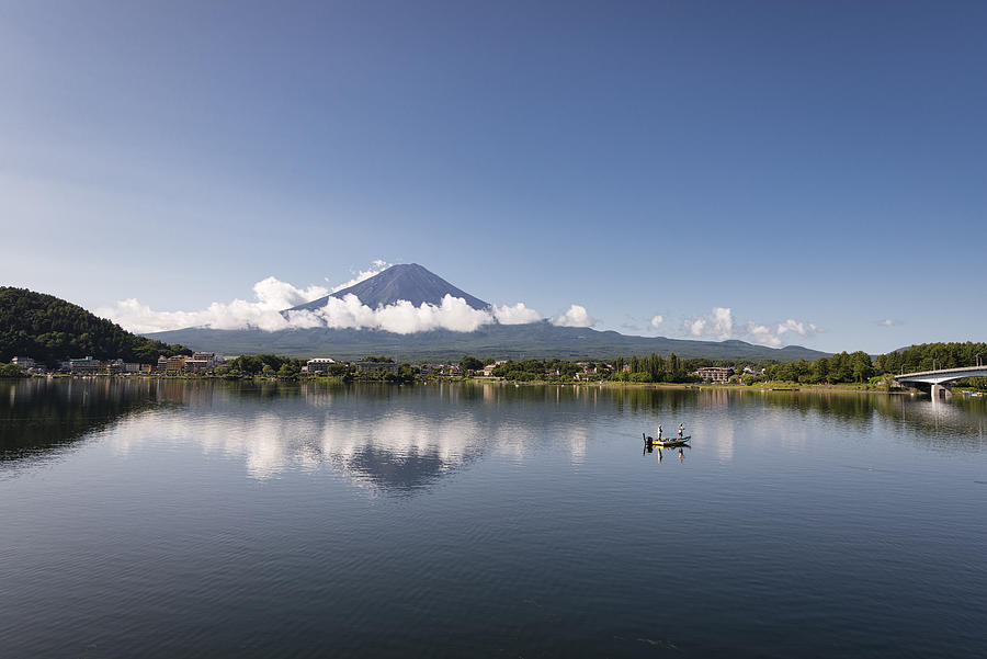Mt. Fuji and Fishing Board Floating on Lake Kawaguchi Photograph by Yuga Kurita