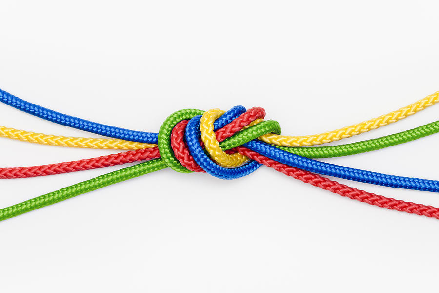 Mulitcolored ropes tied in a knot Photograph by Jorg Greuel