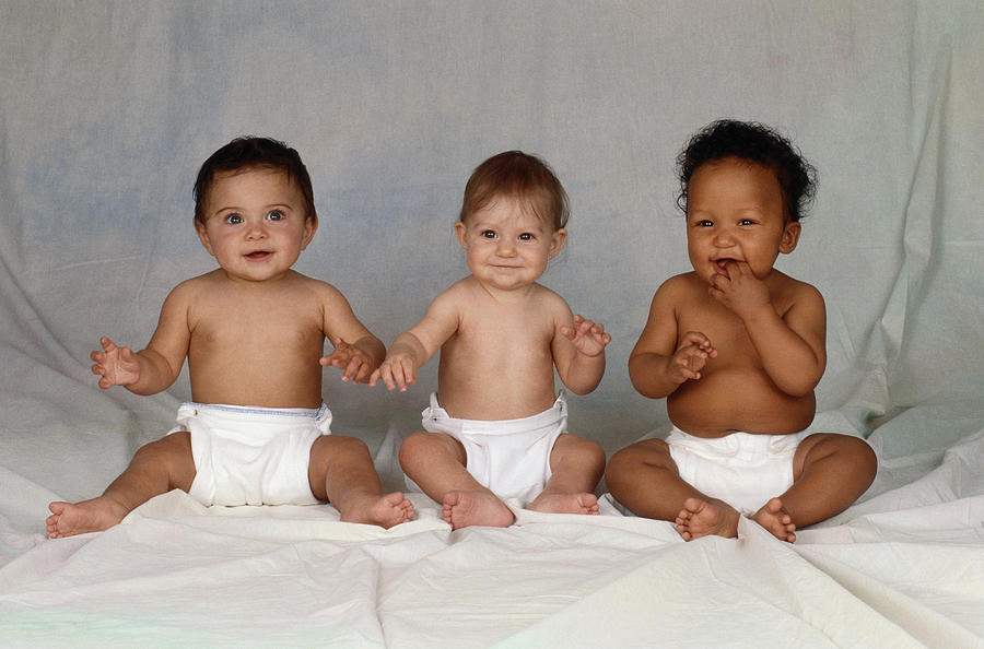 Multi-ethnic Babies Sitting In Diapers Photograph by Nancy Brown