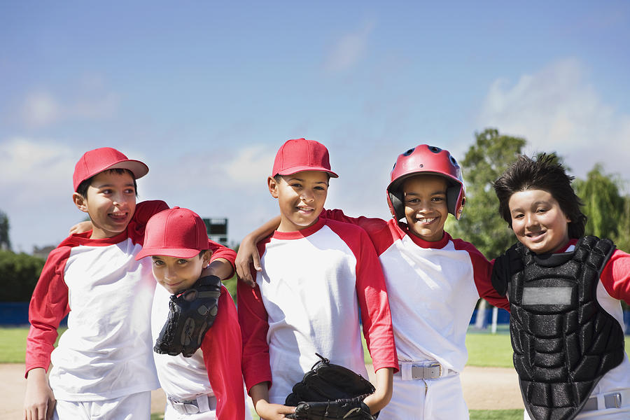 Multi-ethnic boys in baseball uniforms Photograph by Kris Timken