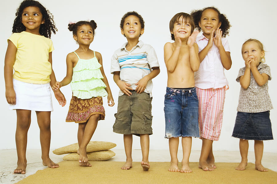 Multi-ethnic children looking excited Photograph by Karin Dreyer
