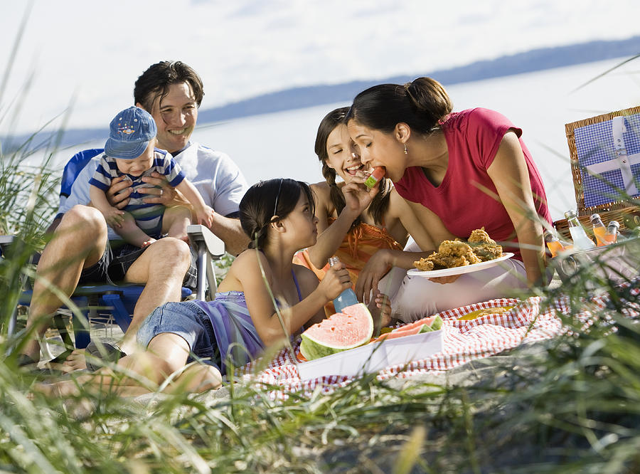 Multi-ethnic family having picnic Photograph by Andersen Ross Photography Inc
