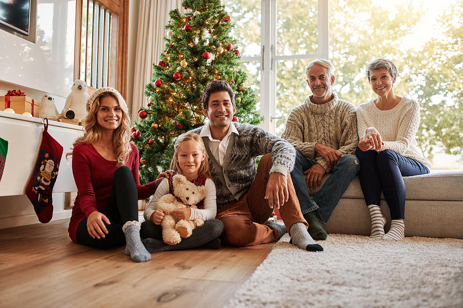 Multi generation family in front of christmas tree Photograph by Jacoblund