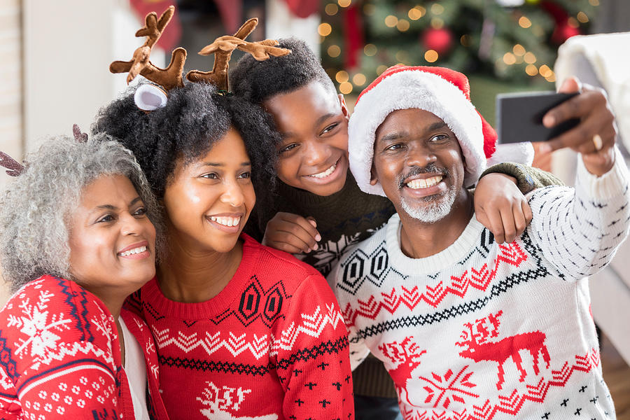 Multi-generational family takes selfie on Christmas morning Photograph by SDI Productions