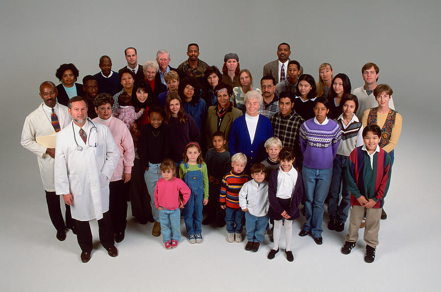 Multi-racial crowd of people, including doctor Photograph by Ron Chapple