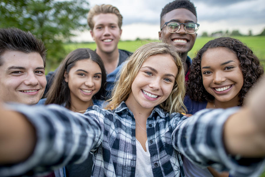 Multi_ethnic Teenagers Taking a Self Portrait stock photo Photograph by FatCamera