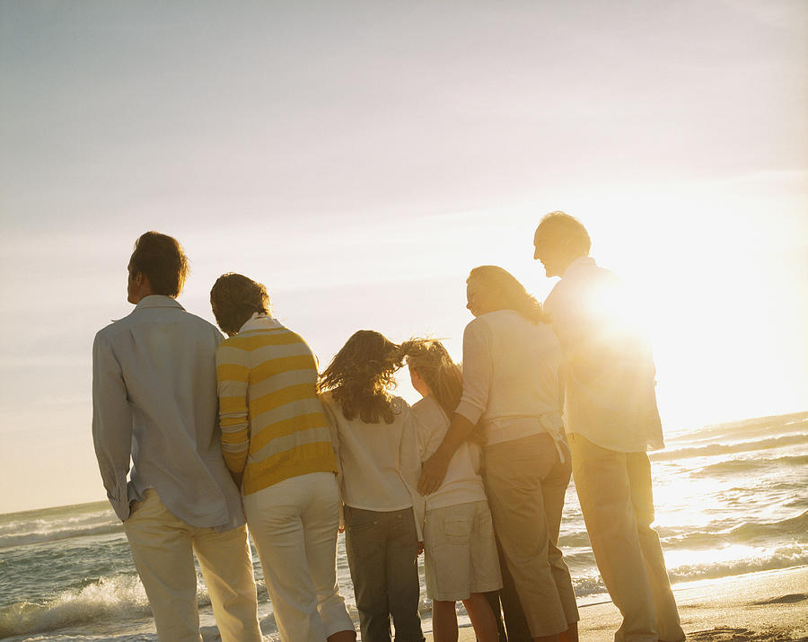 Multigenerational family portrait outdoors at sunset Photograph by Sam Edwards