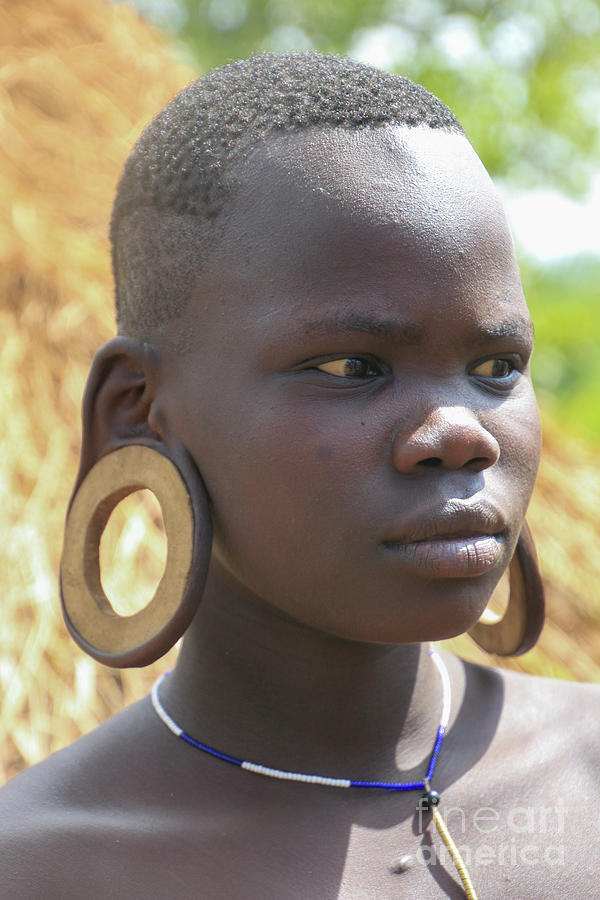 African tribal deals ear stretching