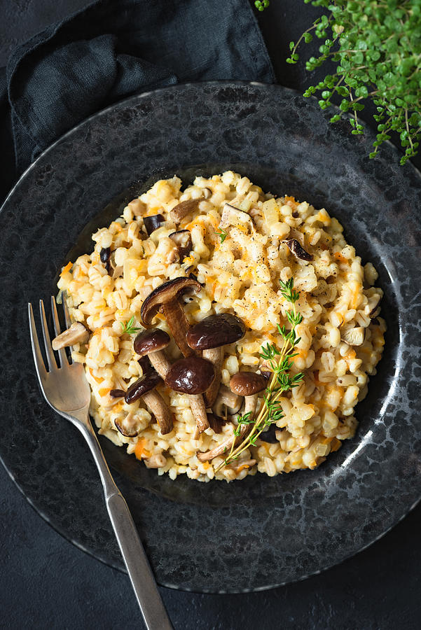 Mushroom Risotto or pearl barley risotto with mushrooms Photograph by Arx0nt