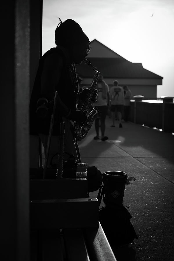 Musician at Pier Photograph by Luis Buitron - Fine Art America