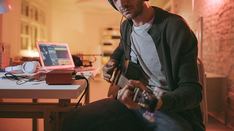Musician in home music studio Photograph by AleksandarNakic Musician in home music studio Photograph by AleksandarNakic