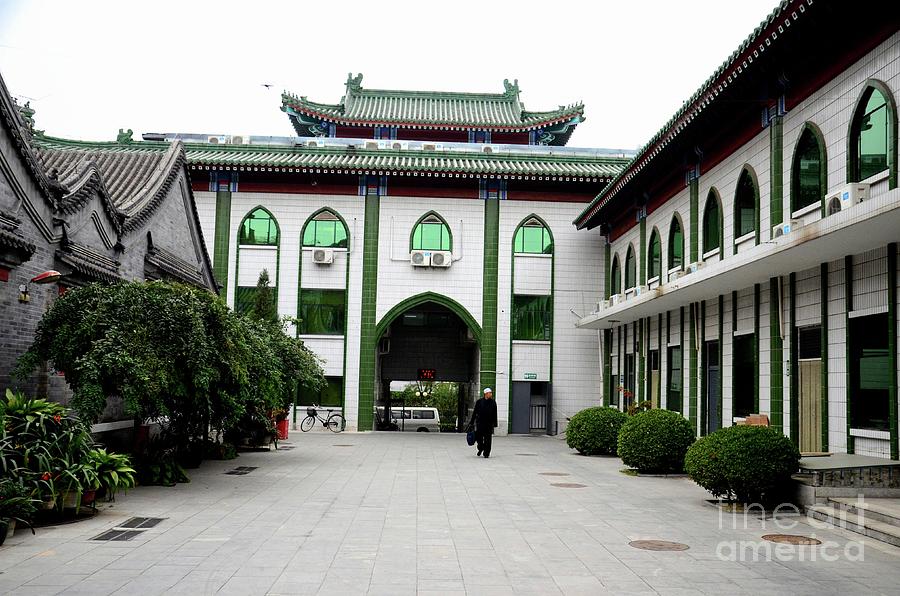 Muslim man walks in entrance courtyard of mosque Beijing China Photograph by Imran Ahmed