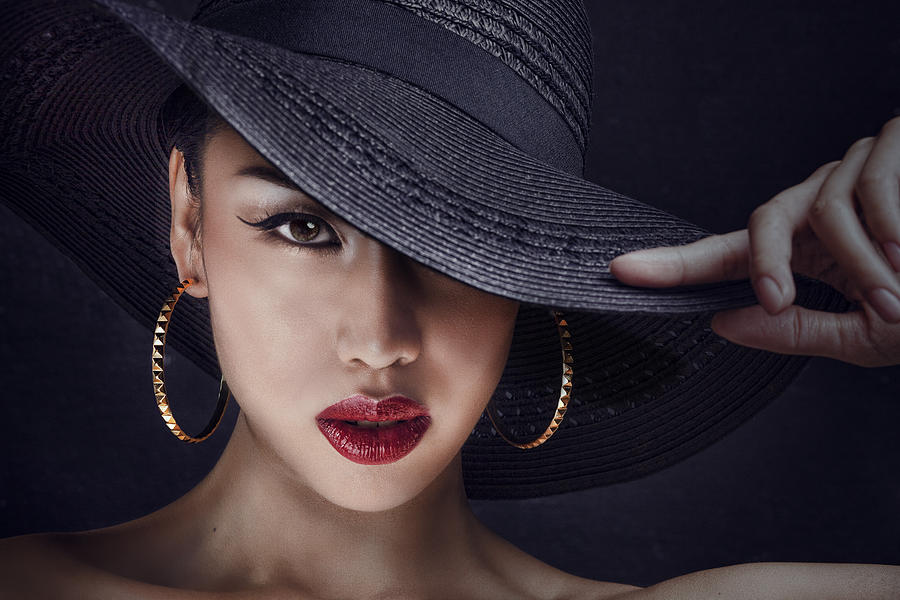 Mysterious Asian woman wearing a big black hat Photograph by Paper Boat Creative