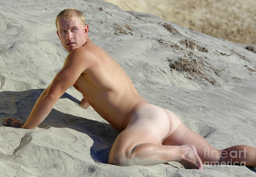 Naked male surfer crawls on the hot sand for a homoerotic pose Photograph by Gunther Allen