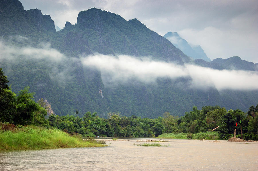 Nam song river and mountain view in Vang vieng Laos Photograph by Arutthaphon Poolsawasd