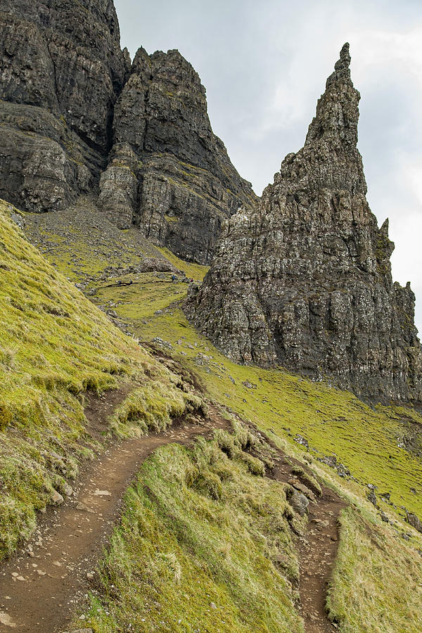 Narrow hiking trail on steep hillside at the Storr rock formatio Photograph by David L Moore