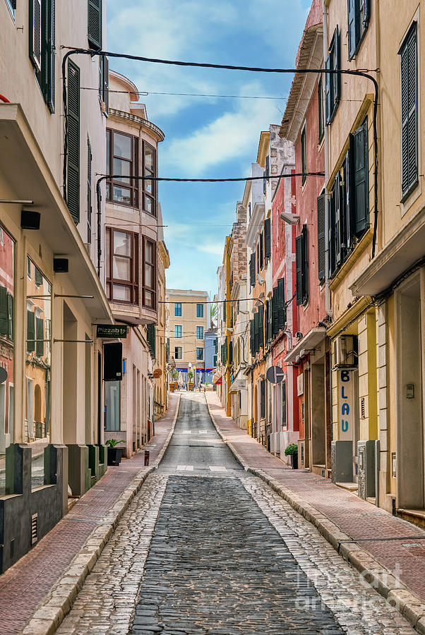 Narrow street in Mahon with old houses - Menorca, Spain Photograph by ...