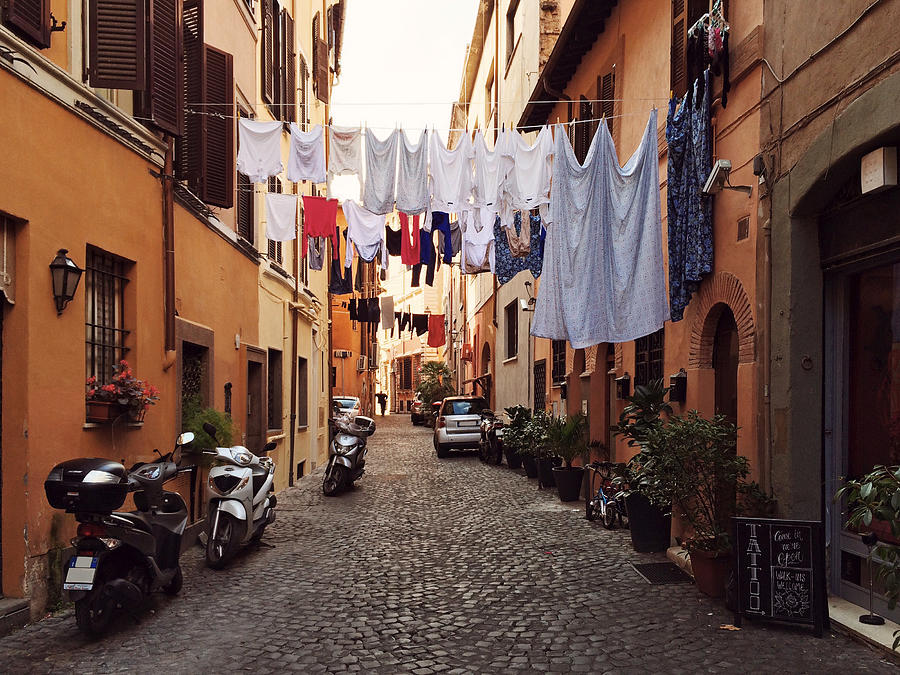 Narrow street in Trastevere with drying clothes Photograph by Alexander Spatari