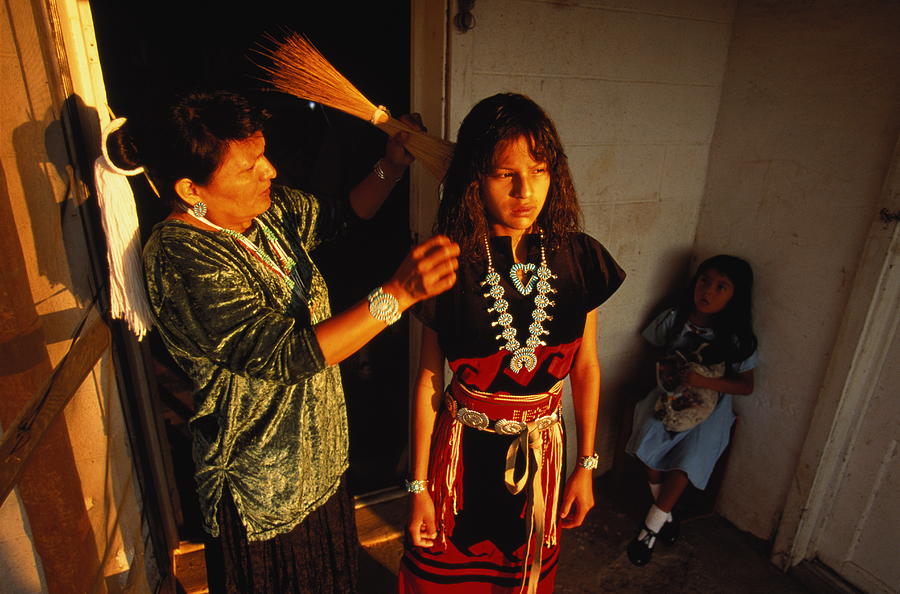 Native American girl getting her hair combed for pow-wow,Arizona,USA Photograph by Paul Chesley