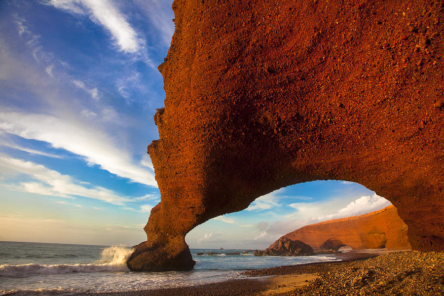 Natural arch rock formations on Legzira Beach, Sidi Ifni, Guelmim-Oued Noun, Morocco Photograph by Tony Yong