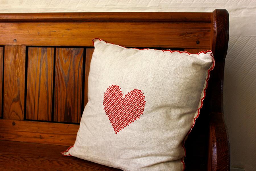 Natural coloured cushion with red nordic heart Photograph by Emma Gibbs