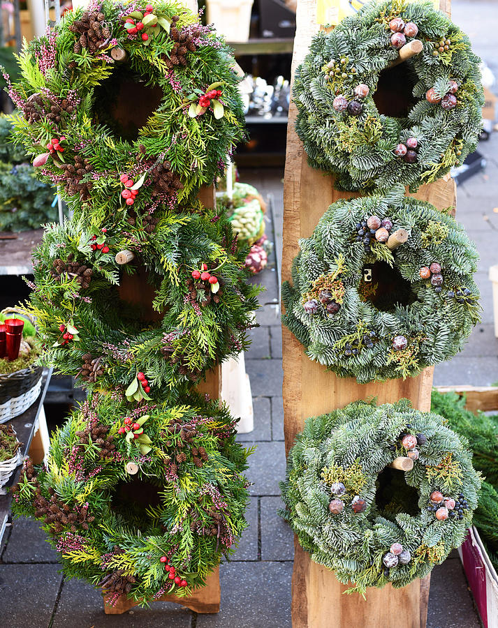 Natural foliage Christmas wreaths for sale in German market Photograph by Lyn Holly Coorg