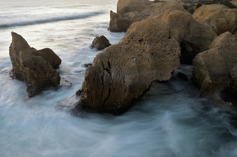 Summer Photograph - Natural Rocky Sculptures and smooth sea waves in Gale Beach by Angelo DeVal