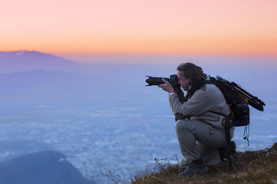 Nature photographer in the mountains  over salzburg Photograph by DieterMeyrl