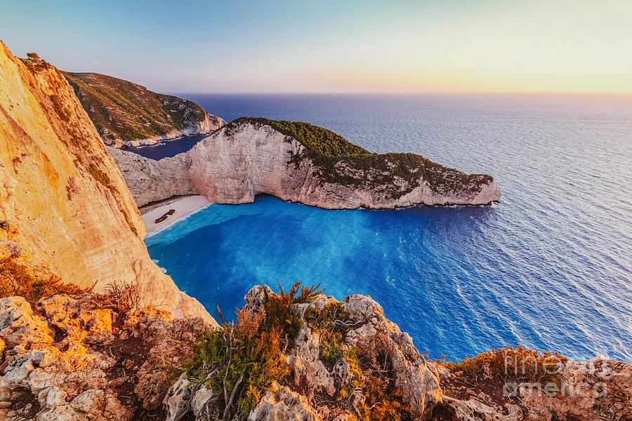 Navagio shipwreck beach in Zakynthos Greece at sunset Photograph by Michal Bednarek