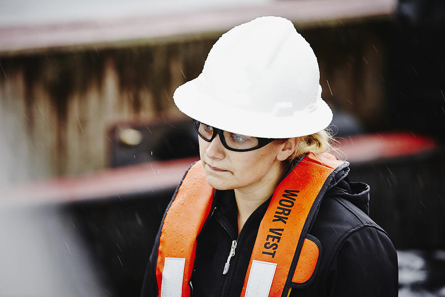 Naval architect wearing hardhat and safety glasses Photograph by Thomas Barwick