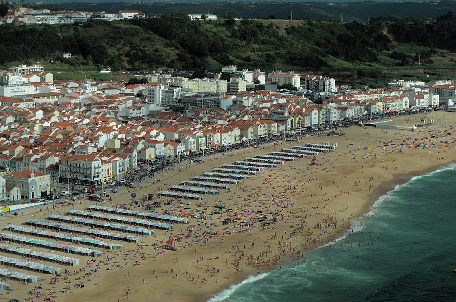 Nazare beach during summertime Photograph by Angelo DeVal