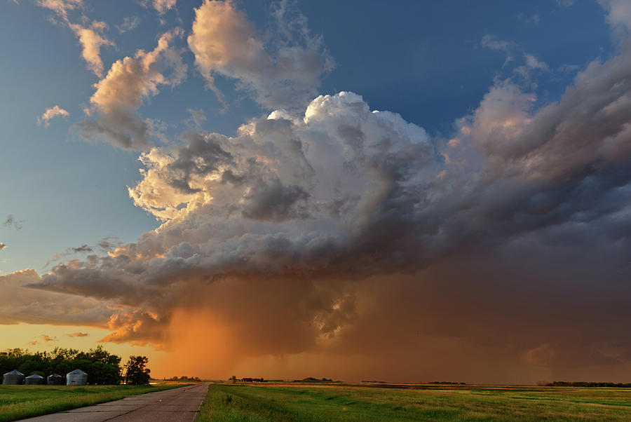 ND Showing off #1 - summer storm above ND highway 281 at sunset Photograph by Peter Herman