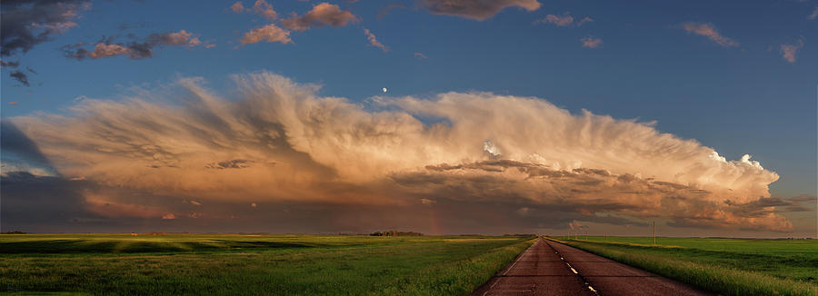 ND Showing off #2 - panorama of massive stormcloud above ND hwy 281 at sunset with moon Photograph by Peter Herman