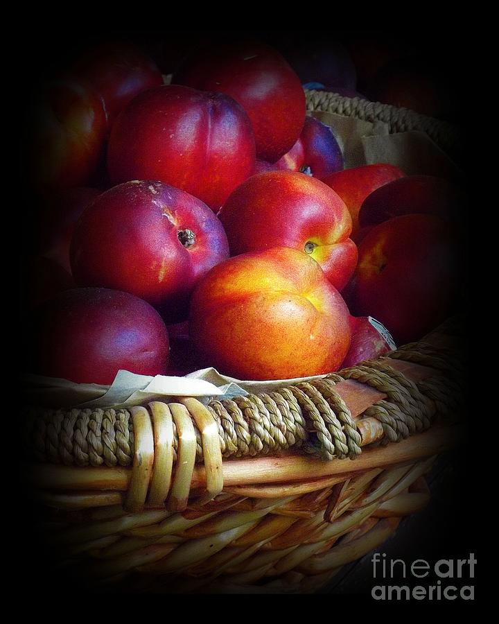 Nectarines in Straw Basket Photograph by Miriam Danar