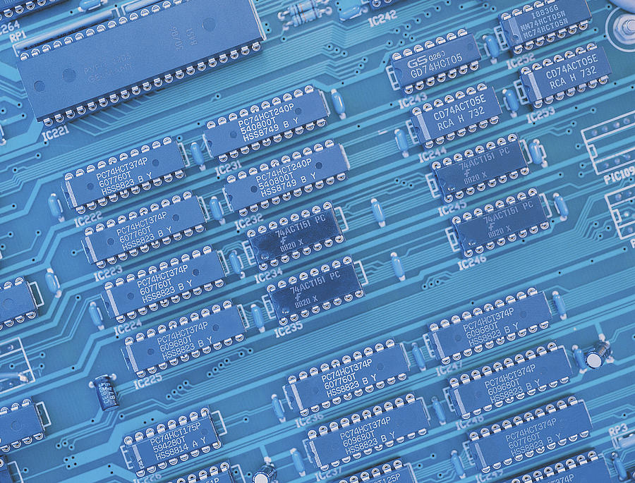 Negative image of micro-chips on a circuit board Photograph by Chris Knapton