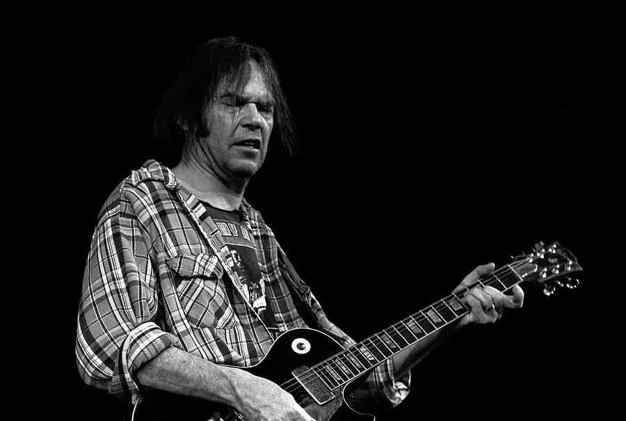 Neil Young playing guitar Photograph by David Ilzhoefer - Pixels