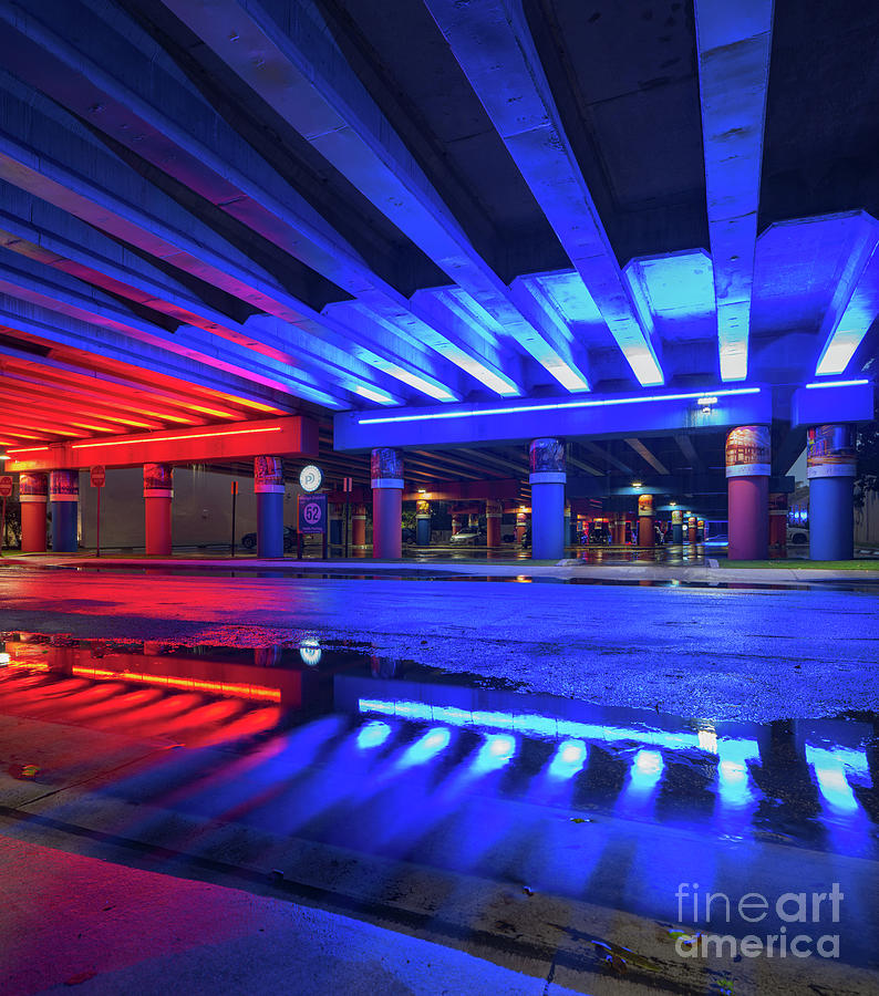 Neon red and blue lights under the bridge Miami Design District
