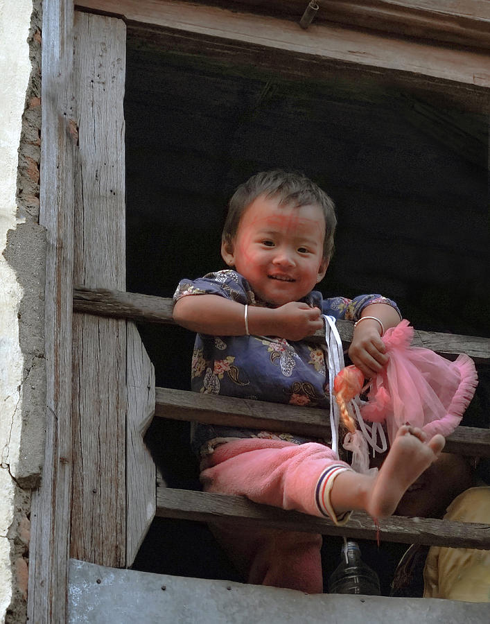 Nepalese Girl in Window with Doll Photograph by Matthew Bamberg