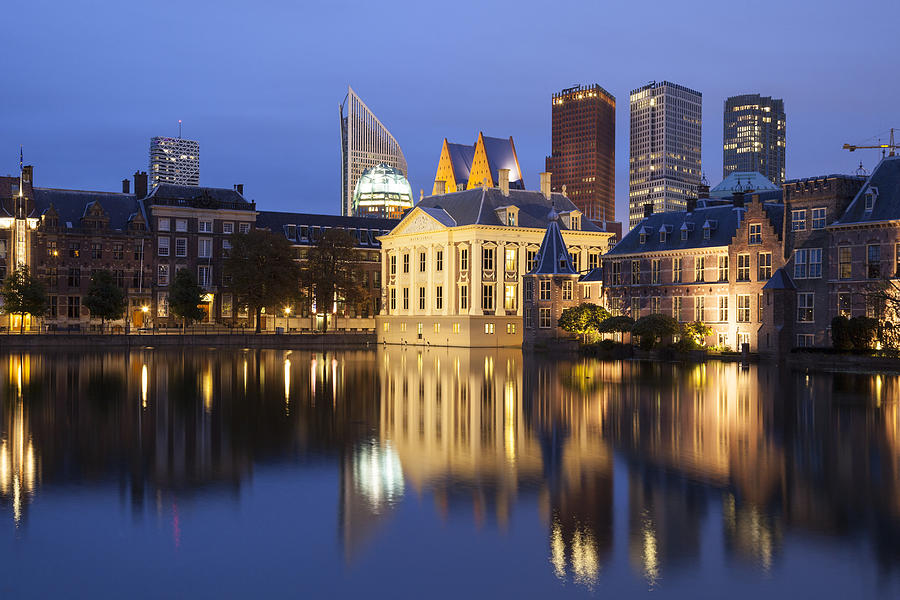 Netherlands, The Hague, Binnenhof, high rise buildings and Museum Mauritshuis at night Photograph by Westend61